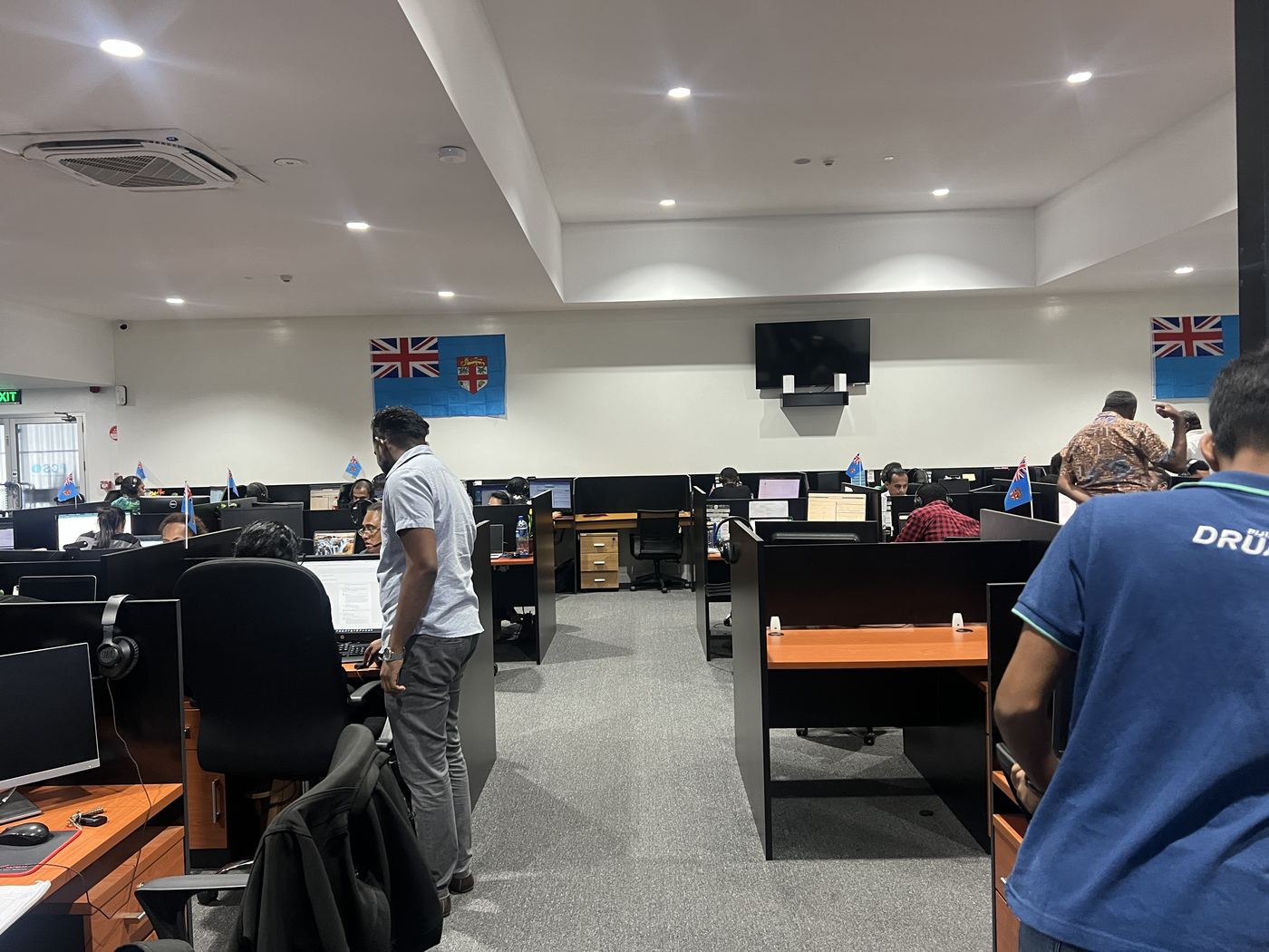 PCS Suva office with glass-walled meeting rooms and blue accent wall