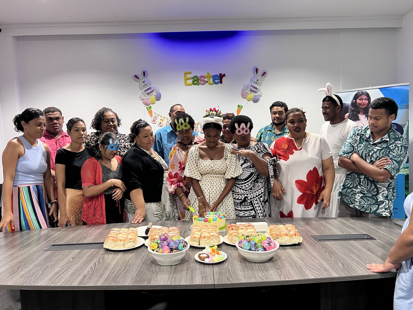 PCS team at the office Easter celebration with hot cross buns