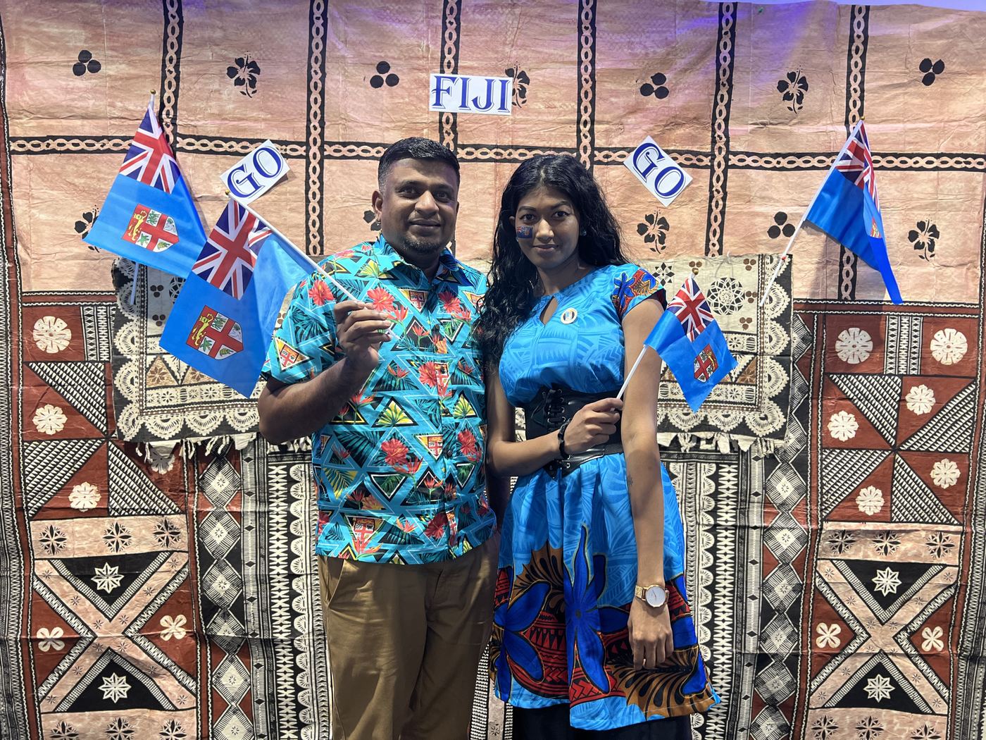 PCS team members celebrating Fiji Day with national flags